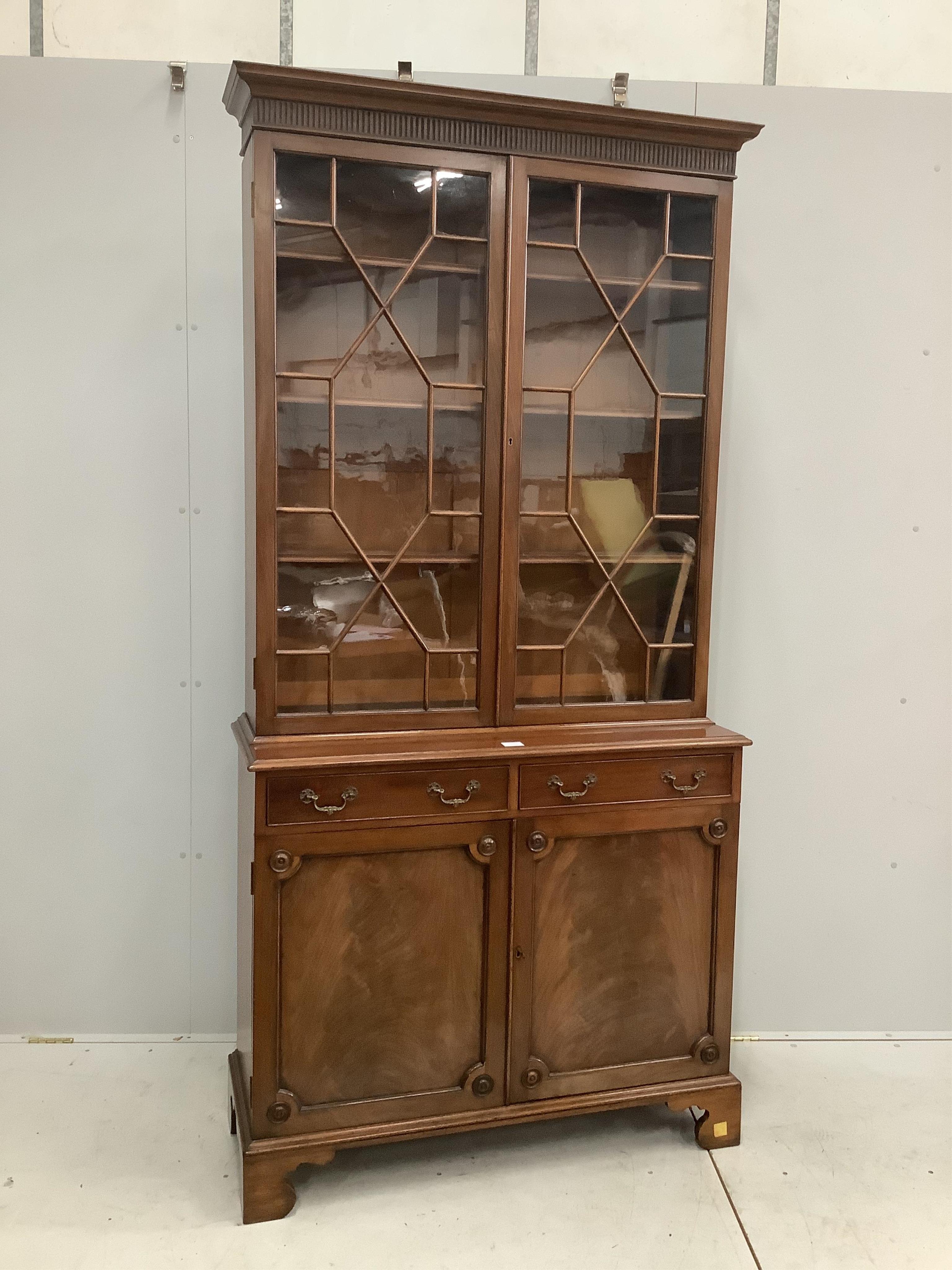 A George III style mahogany bookcase, width 105cm, depth 40cm, height 217cm. Condition - good